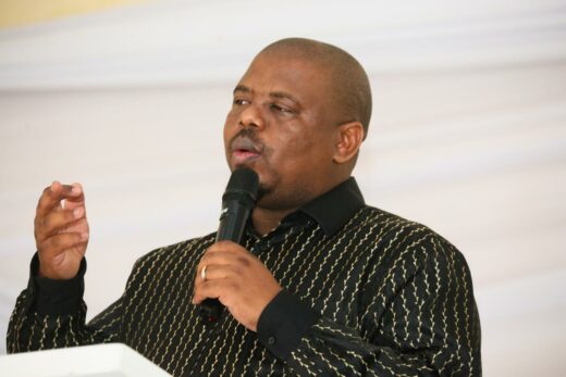 KZN MEC for the Department of Education, Sipho Hlomuka stands outside a school classroom