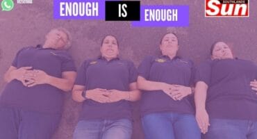 Four women lying down on the ground in solidarity for women murdered due to gender based violence with a purple filter over the image.