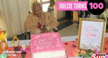 Wentworth’s Dulcie Marnce in her wheelchair behind her birthday cake and frame that is celebrating her 100th birthday.