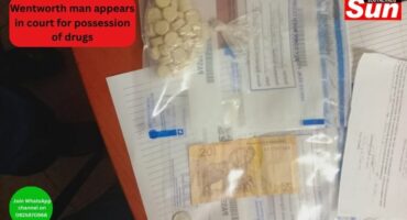 A bag of mandrax tablets and R25 cash with police documents on a table