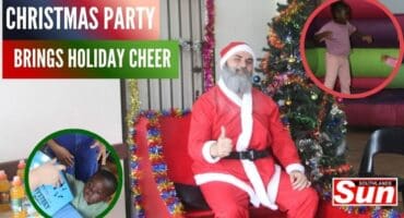 Ryan Hunzvi , Father Christmas Caleb Smith and Lethabo Langa having a blast at the Christmas party.