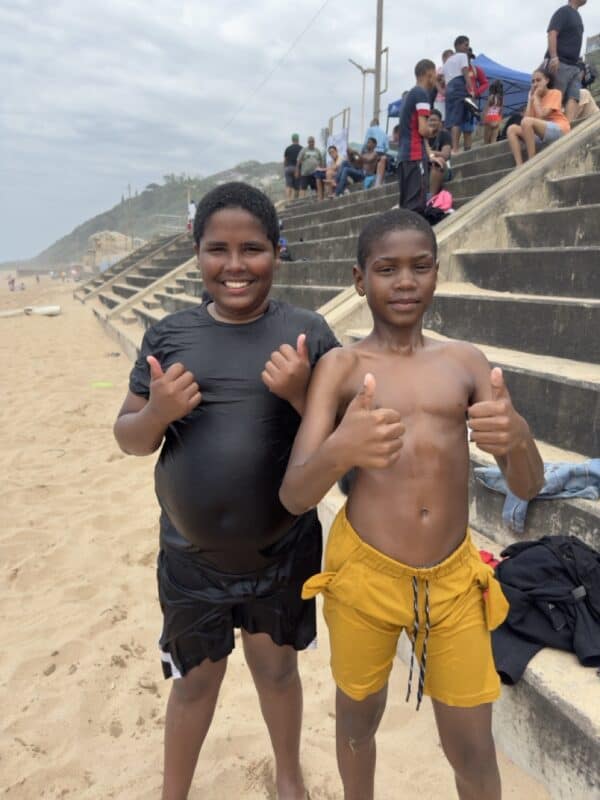 Devante Nero and Kayden Anderson have a blast at the beach.