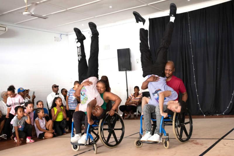 Dancers performing in wheelchairs.