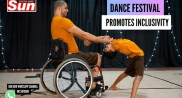 A wheelchair bound person dancing on stage