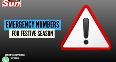 Caution sign with text 'Festive season emergency numbers'