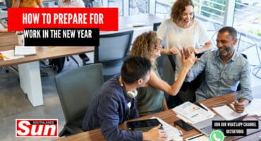 A group of people socialising at the office.