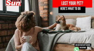 A woman petting her dog.