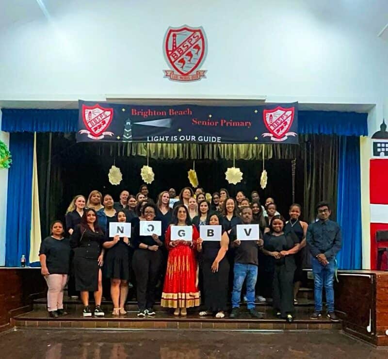 Staff at Brighton Beach Primary School show their support for 16 Days of Activism. 
