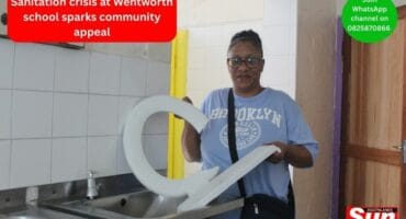 Treasurer of Umbilo Secondary School, Leigh Webster shows broken materials removed from girls' toilet.