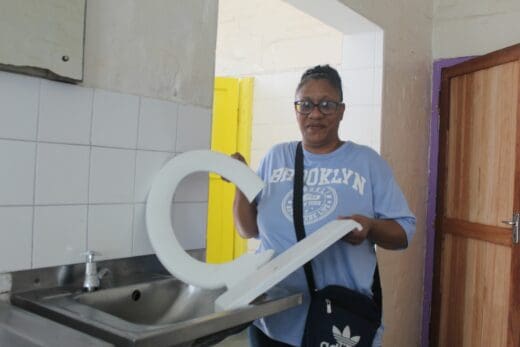 Treasurer of Umbilo Secondary School, Leigh Webster shows broken materials removed from girls' toilet.