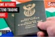 A picture of the South African passport in front of the South African flag.