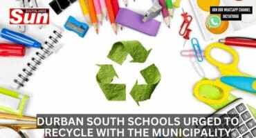 A recycling sign surrounded by stationery.