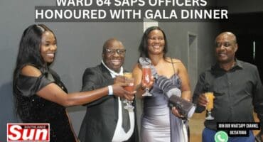 A group of people toast with each other at an event.