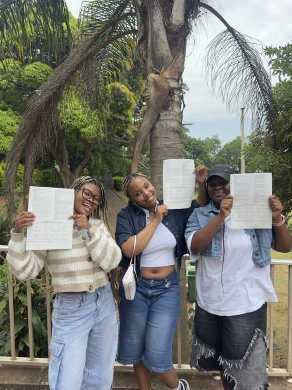 Mowat Park High School’s Asiphile Simelane, Teddy Mbhele and Yolanda Dube strike a pose with their statement of results.