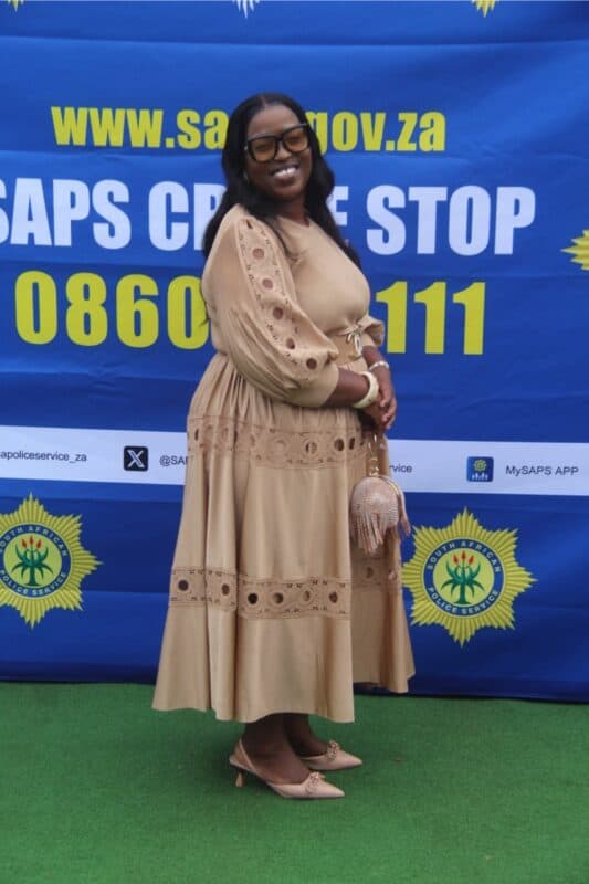 A woman dressed in her best outfit for the event.