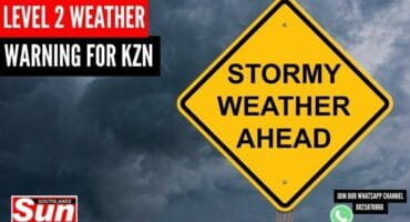 A sign in front of stormy weather.