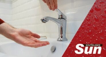 A person opening an empty tap.