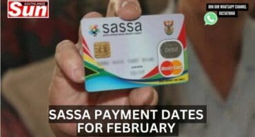 A woman holding a Sassa card in her hand.