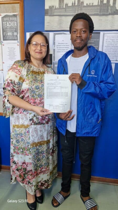 Wentworth Secondary School's principal with one of the top achievers who secured Bachelors Pass with six distinctions.