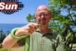Warren Dick with the captured green mamba on The Bluff.