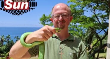 Warren Dick with the captured green mamba on The Bluff.