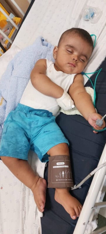 Baby Zayden lying in hospital during one of his frequent trips. 