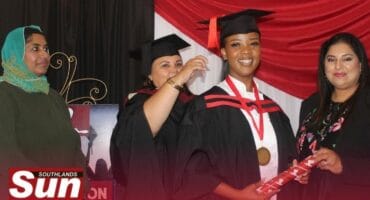 Chef Sajedah Ebrahim from Sanzaf Chef School and Chef Vandhana Ramsoonder from Ethekwini Tvet College support Chef Fatima Stanley as she caps and gowns Kholeka Mnyandu