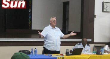 Ward 64 councillor Norman Gilbert addresses residents at a meeting.