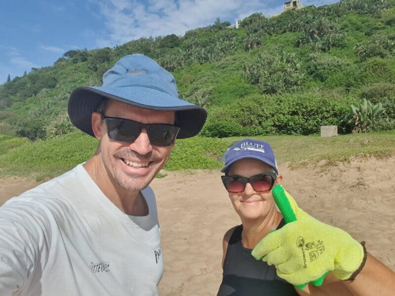 Rudi Clark, The Litterboom Project, and Ronel Lategan, Bluff Ratepayers and Residents association take a quick snap while putting in the work.