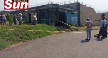 Police and community members at the scene in Hime Street.