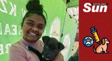 Kayleen Madasamy holding one of the dogs at the clinics.