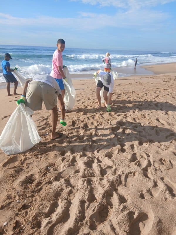 Grosvenor Boys High School learns do their bit and help clean-up.