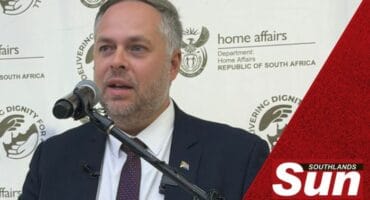 Minister of Home Affairs Dr. Leon Schreiber speaking at a briefing.