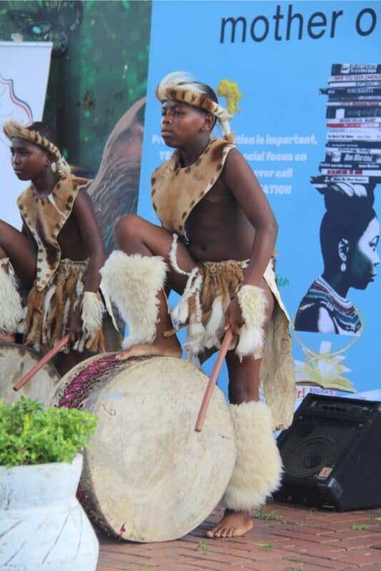 Thabiso Mphuthing plays the drums during the dancing act. 