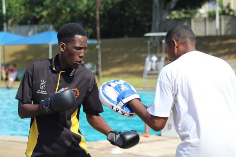 Langalakhe Makathini swings some punches while training with Alex Uys. 