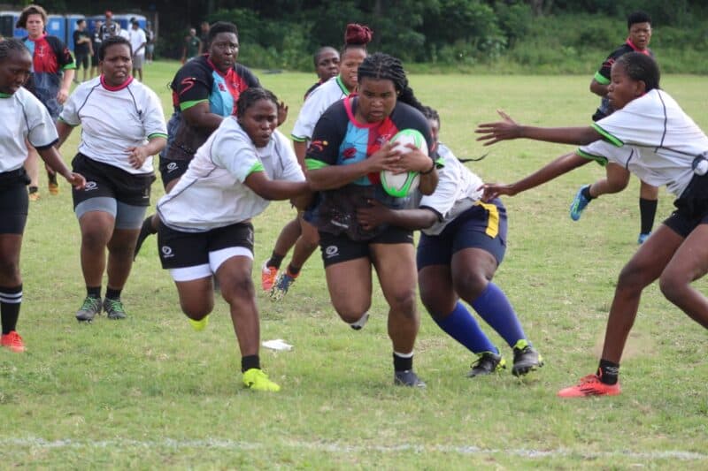Harlequins women's Zizipho Ngqunguza pushes through as she closes in on the try line.