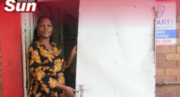 Manager of the Merwent Cheshire Home Winnie Mkhize with the door that has fallen of its hinges.