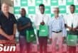 Leon Haggie, Mill Manager at the Sezela plant; Mr Mkhize, parent of Luyanda Mkhize, who accepted the bursary on his son’s behalf; Ntando Myende of Sihle High; Illovo Sugar South Africa MD, Ricky Govender; and Mpilwenhle Mngoma, also from Sihle High who also received a bursary. Photo: Supplied.
