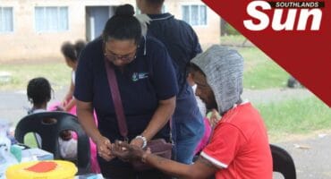 Nurse Judith Gilbert tests Bradon Kibbe’s sugar.
