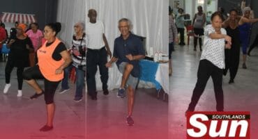 Christina Foyie, Len Anderson and Lenette Smith stretch their arms and legs during their exercise.