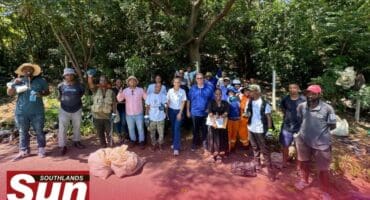 Various stakeholders coming together to help clean up the Glanville Road Garden Refuse Site.