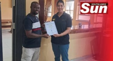 Deon Foster hands Chantal Bransgrove-Bower her certificate for completing the course.