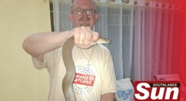 Warren Dick with the captured Mozambican spitting cobra.