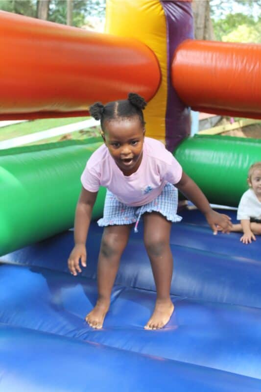 Kukhanya Twala has fun on the jumping castle.