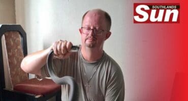 Warren Dick with the captured black mamba.