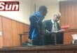 Advocate Ali Essop talks to his client, Mzomuhle Lawrence Gamede in court