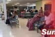 Patients seated in the waiting area of a public hospital