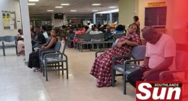 Patients seated in the waiting area of a public hospital