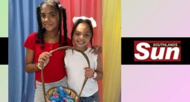 Amara Constable and Ziah Christian share a basket of Easter eggs.