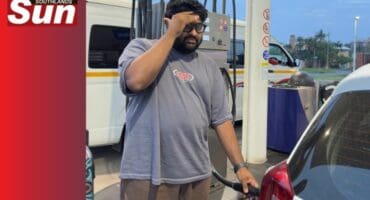 Dillon Pillay fills fuel in his car worriedly.